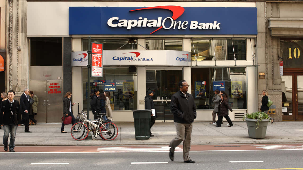 Passersby In Front Capital One Background