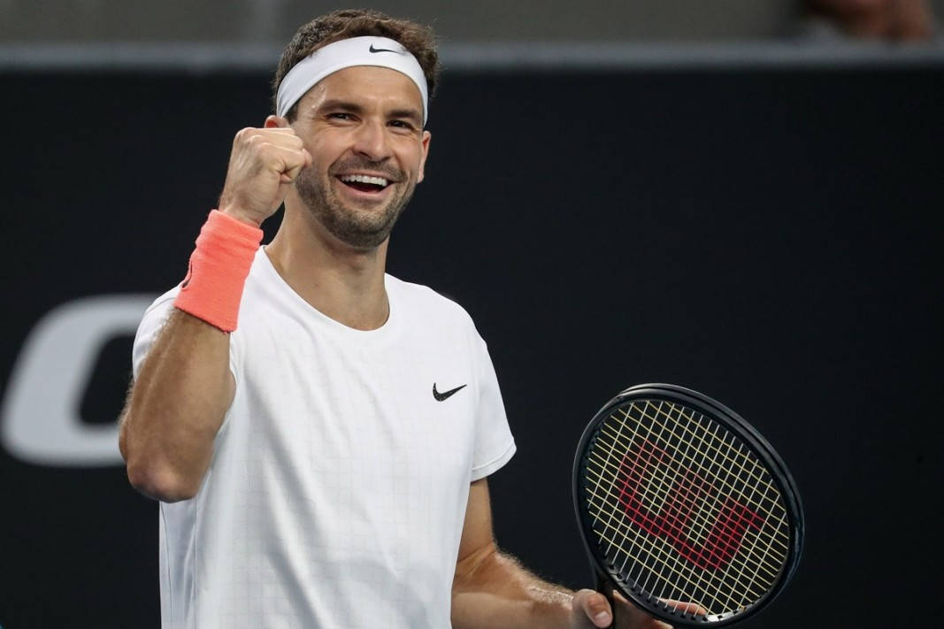 Passionate Grigor Dimitrov Celebrating Victory With A Fist Pump Background