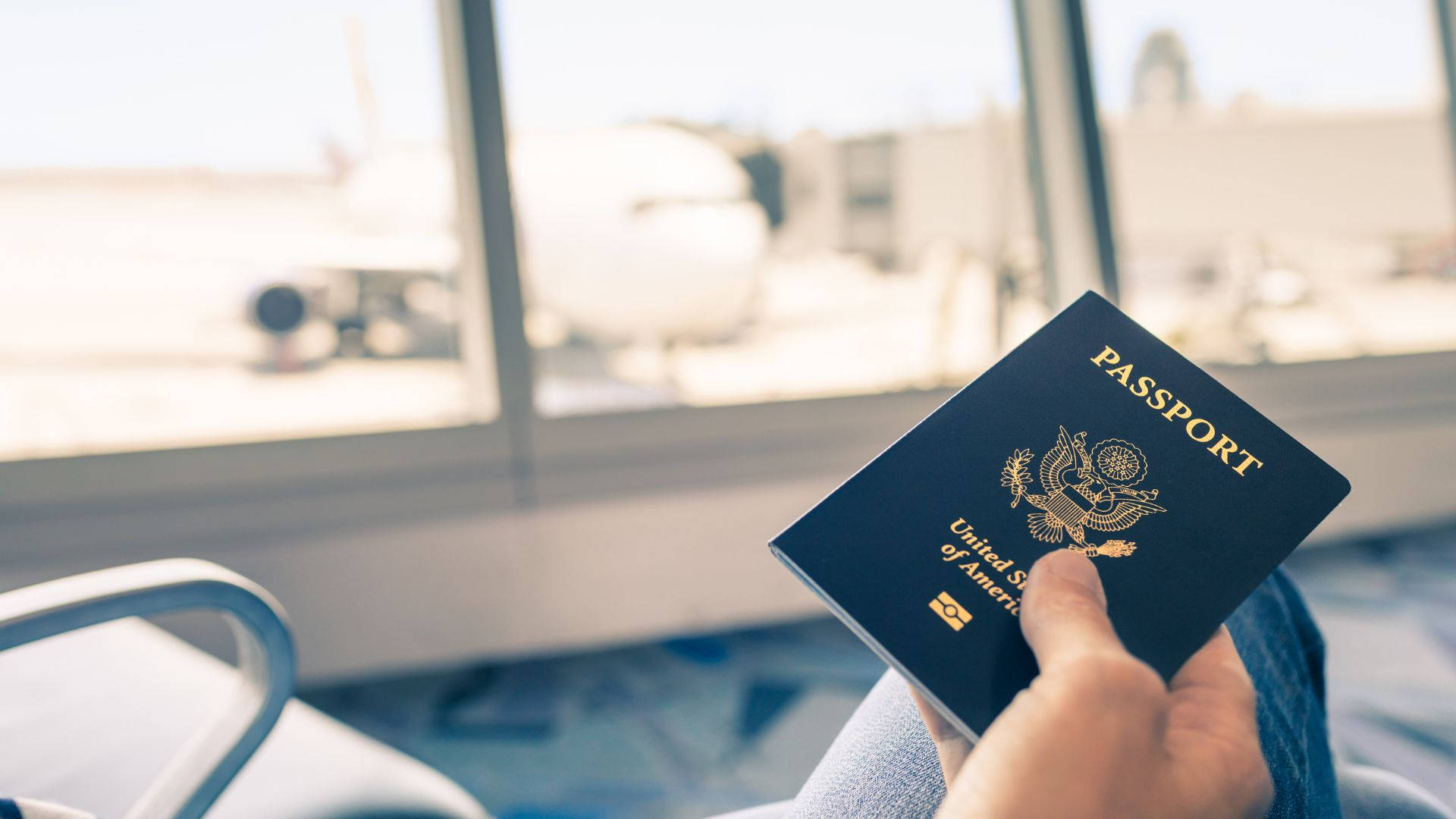 Passport Holding At Airport Background