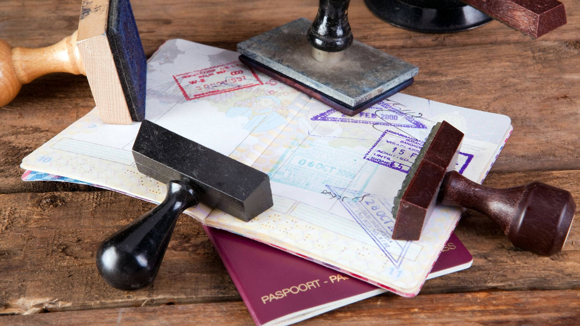 Passport Stamps On Table Background