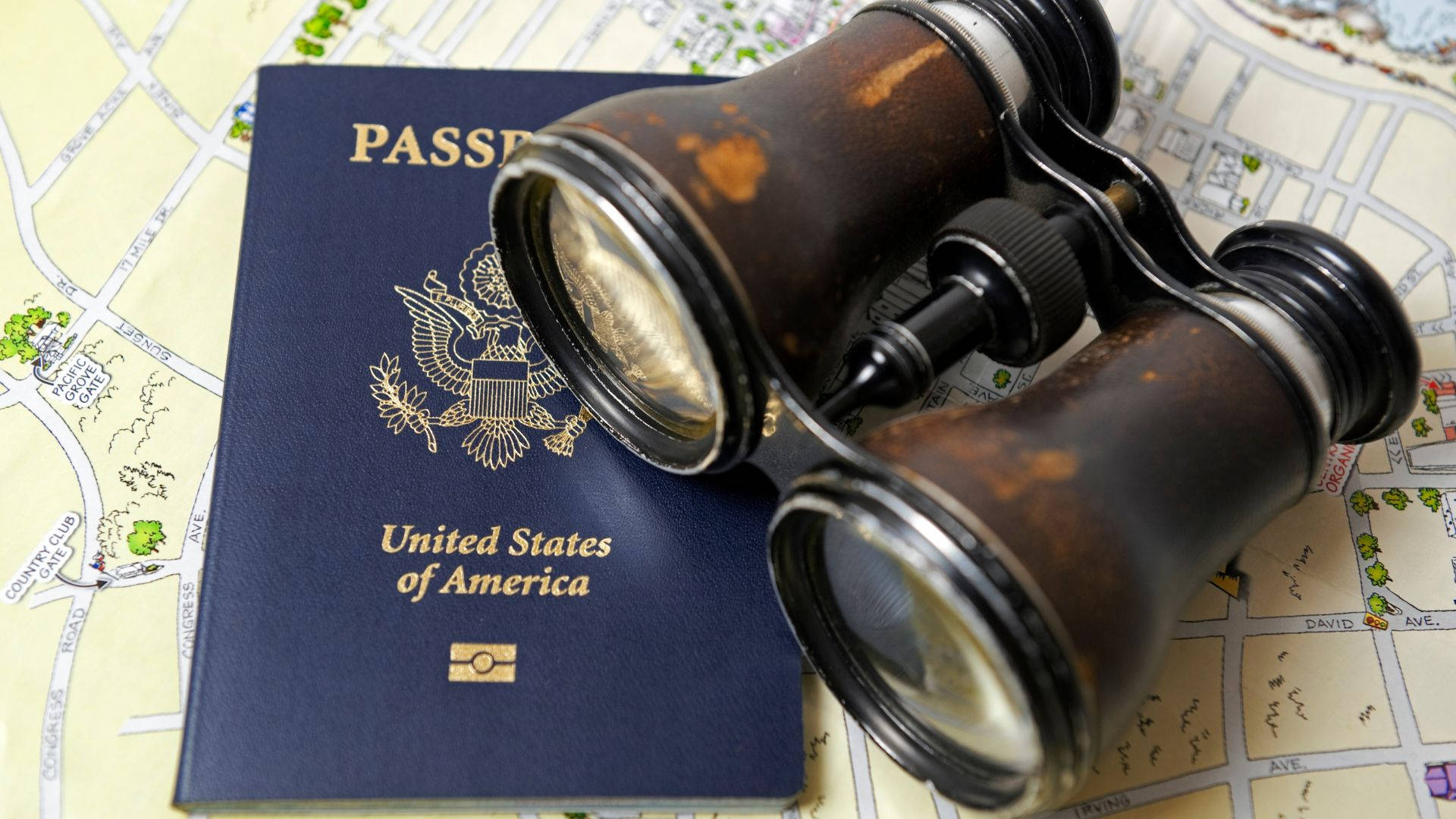 Passport With Old Binoculars Background