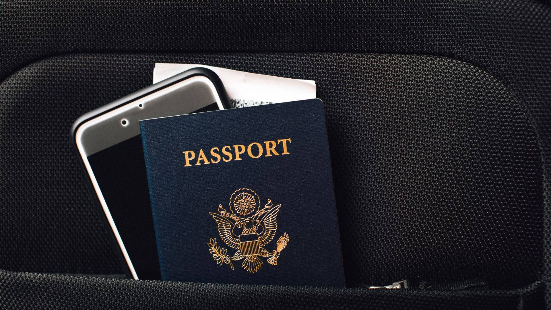 Passport With Phone Inside A Pocket Background