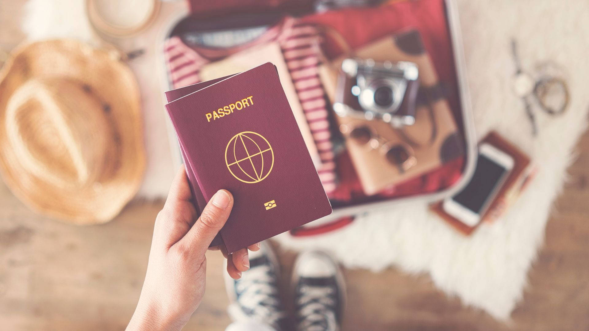 Passport With Travel Essentials Background