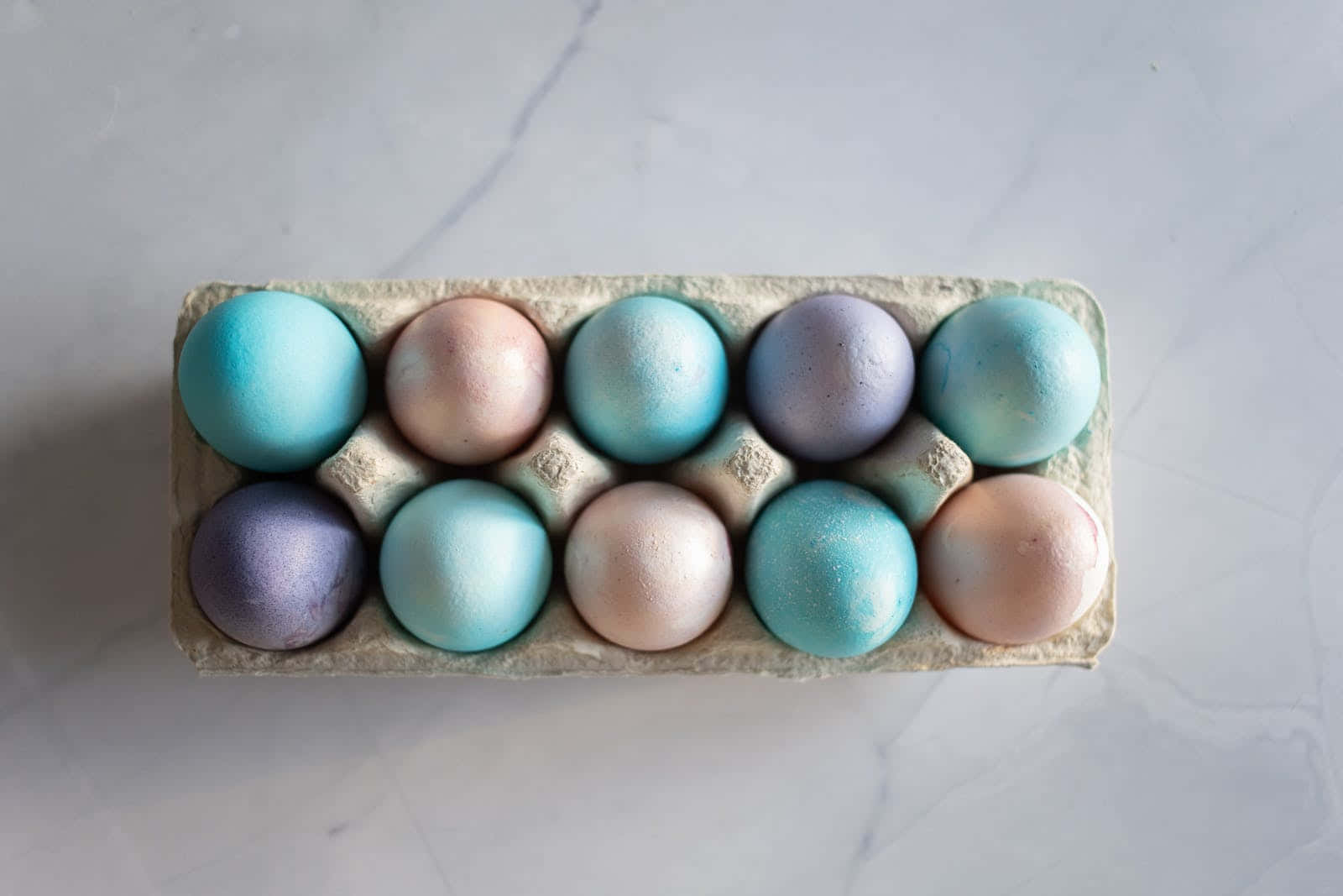 Pastel Easter Eggs On Tray Background