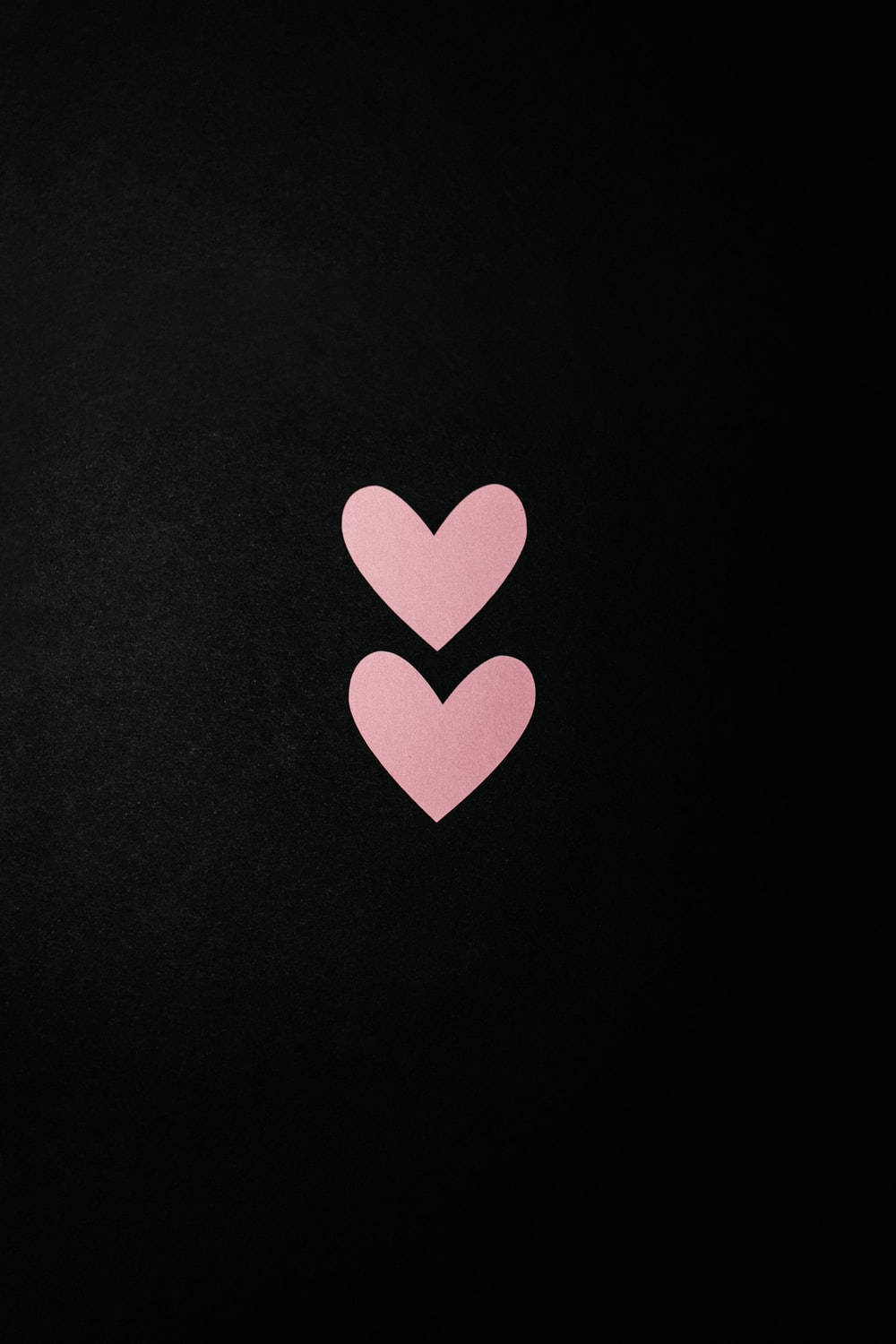 Pastel Pink Heart In Black Background Background