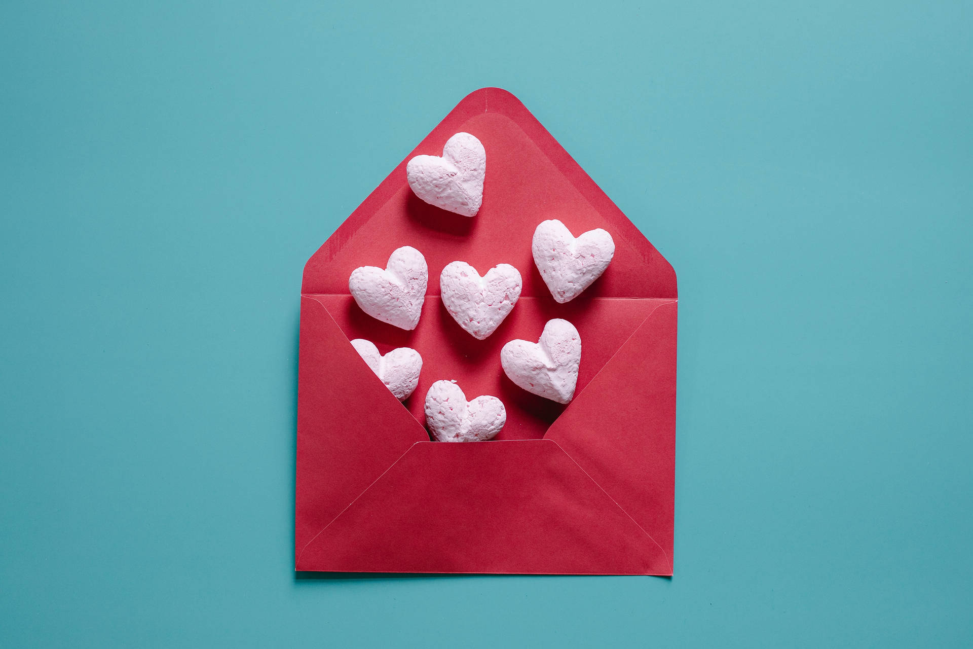 Pastel Pink Heart Shapes In Envelope Background
