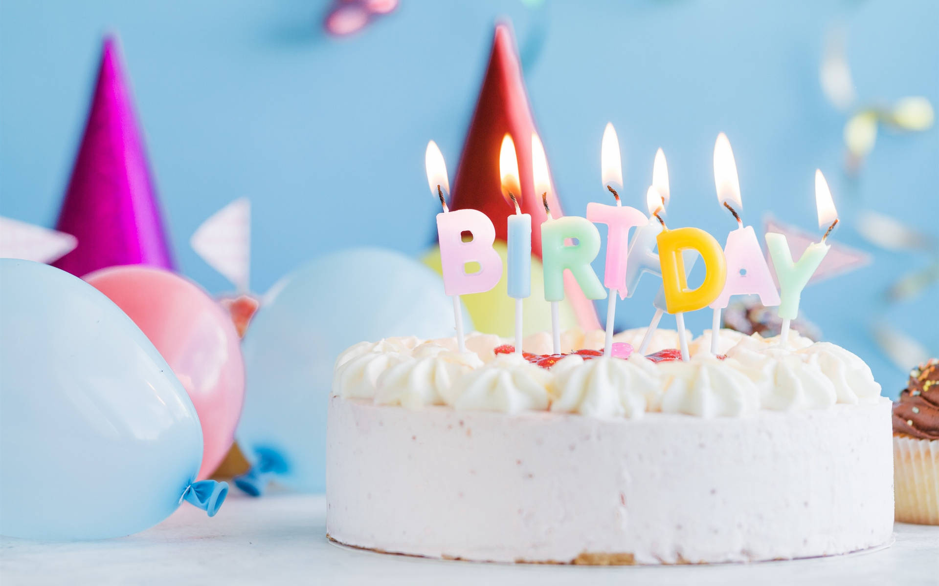 Pastel White Birthday Cake With Lit Candles Background