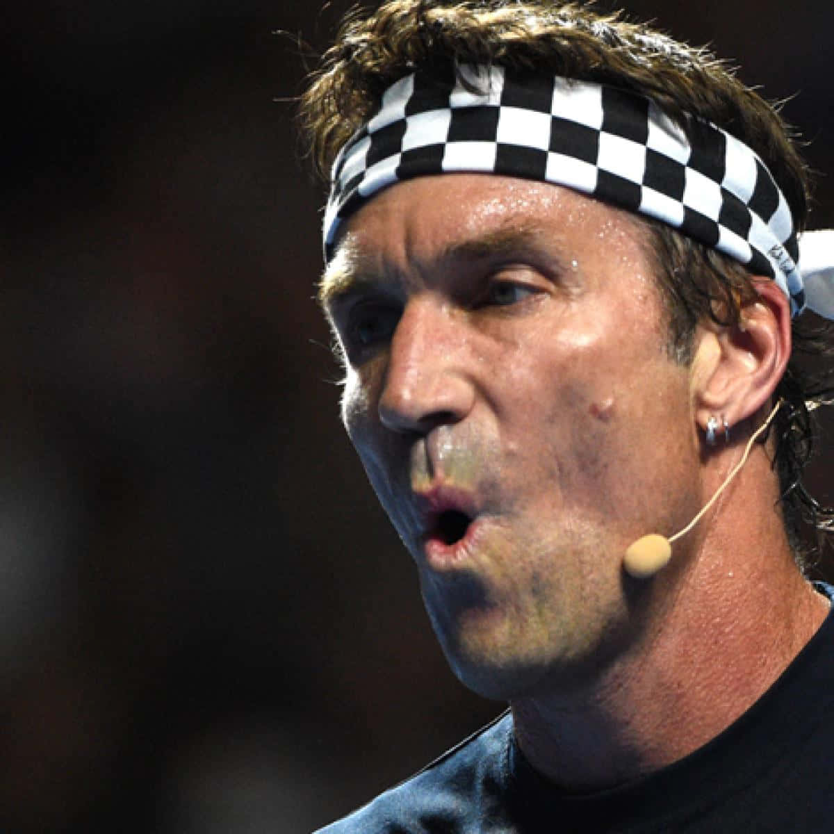 Pat Cash With His Black And White Hair Band Background