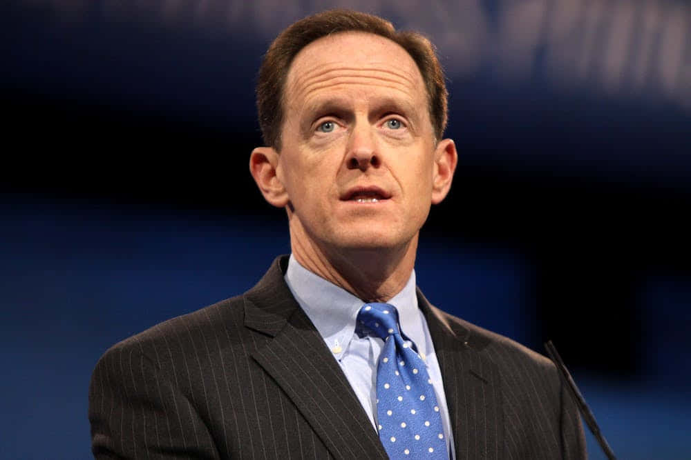 Pat Toomey Dressed In Blue Tie Background