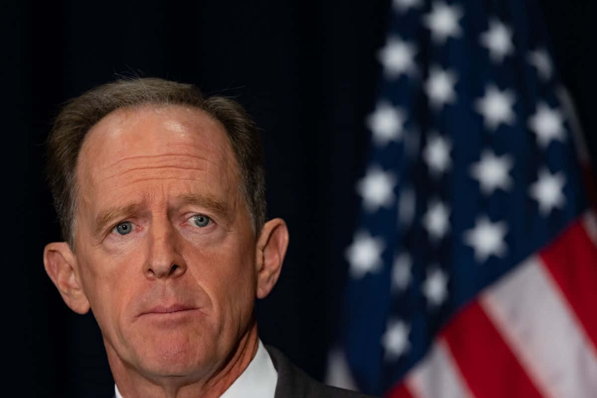 Pat Toomey Intently Listens To A Question During A Conference