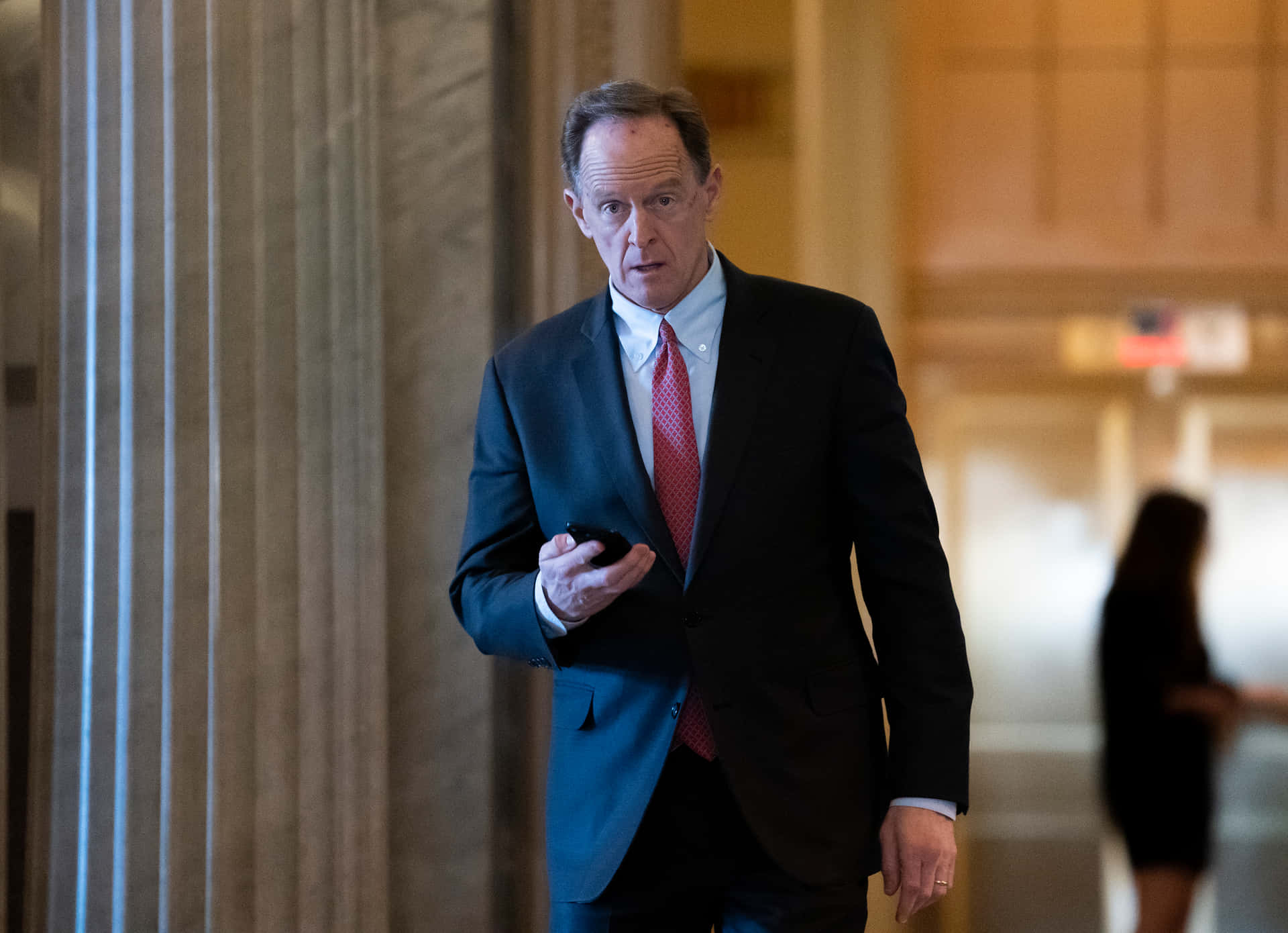 Pat Toomey Looking At Phone Background