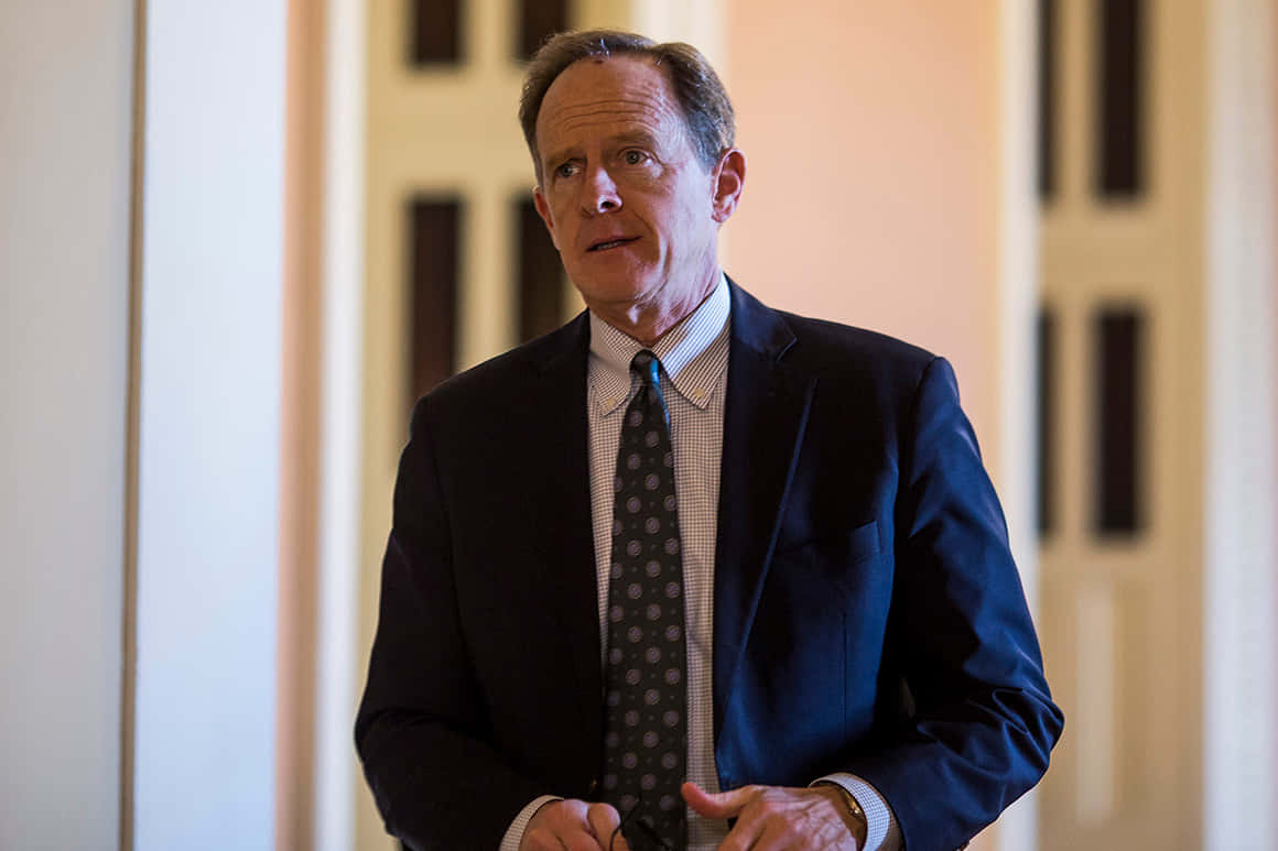 Pat Toomey With Hands On His Front Background