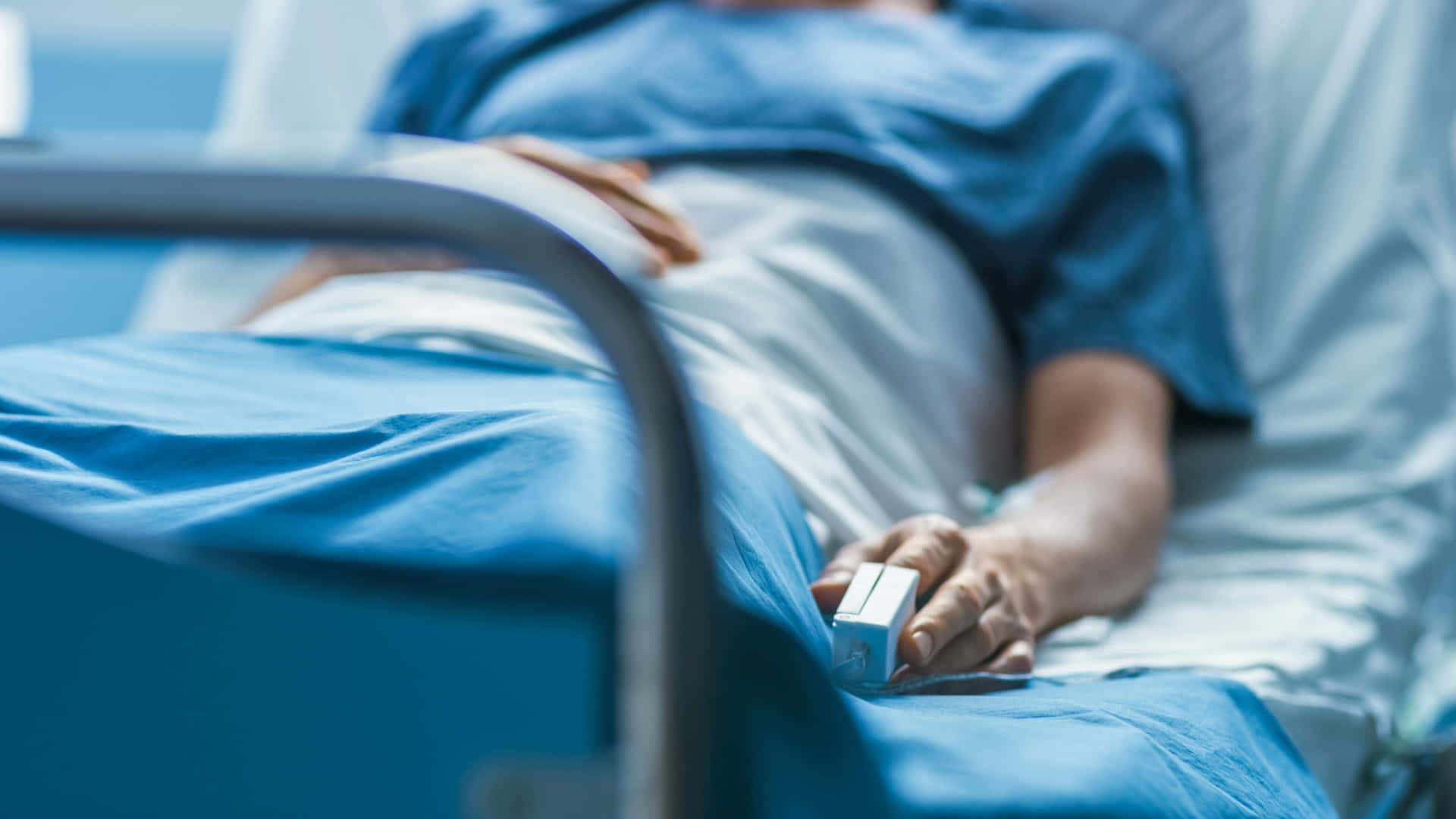 Patient Lying On Hospital Bed Background