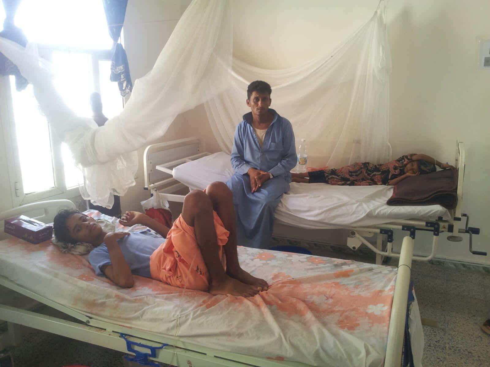 Patient Relaxing On Public Hospital Bed