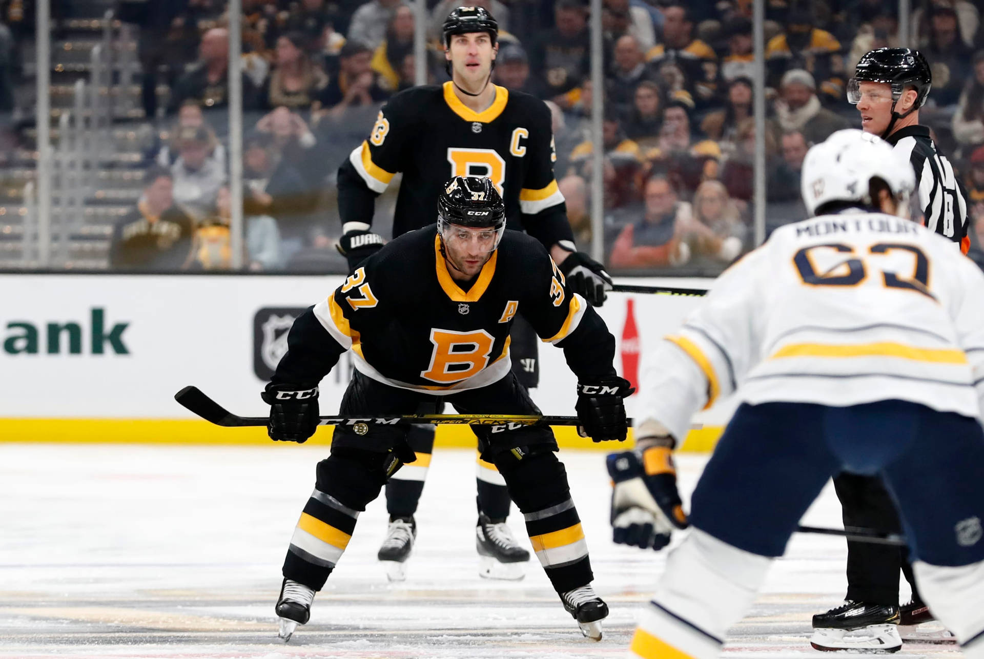 Patrice Bergeron In Action During A Game Against Buffalo Sabres Background