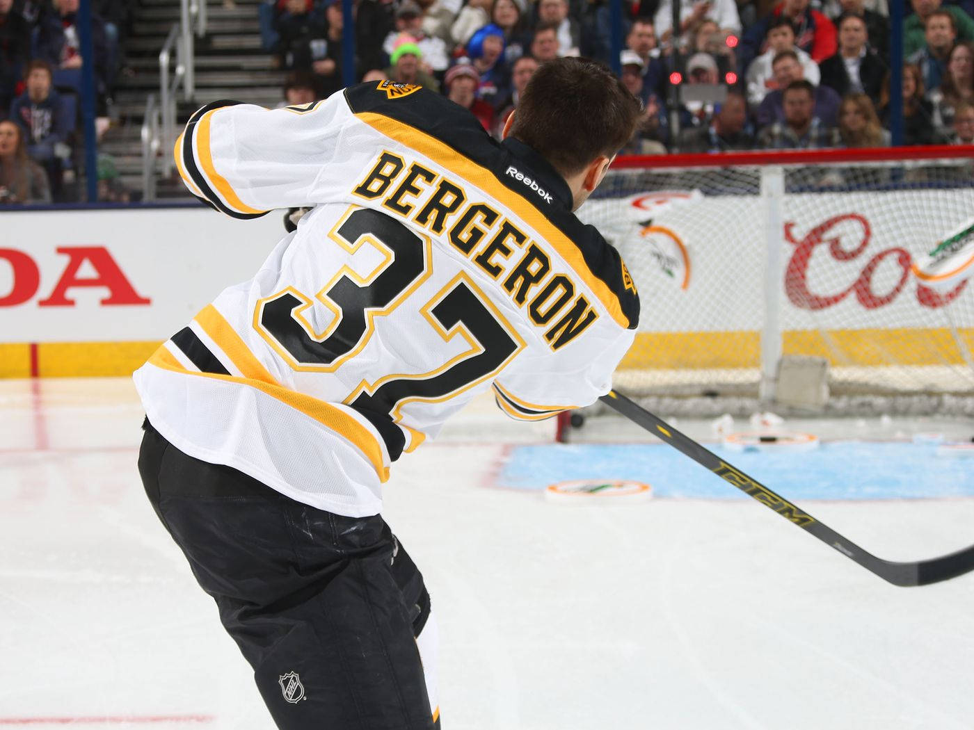 Patrice Bergeron In Action During A Hockey Game Background