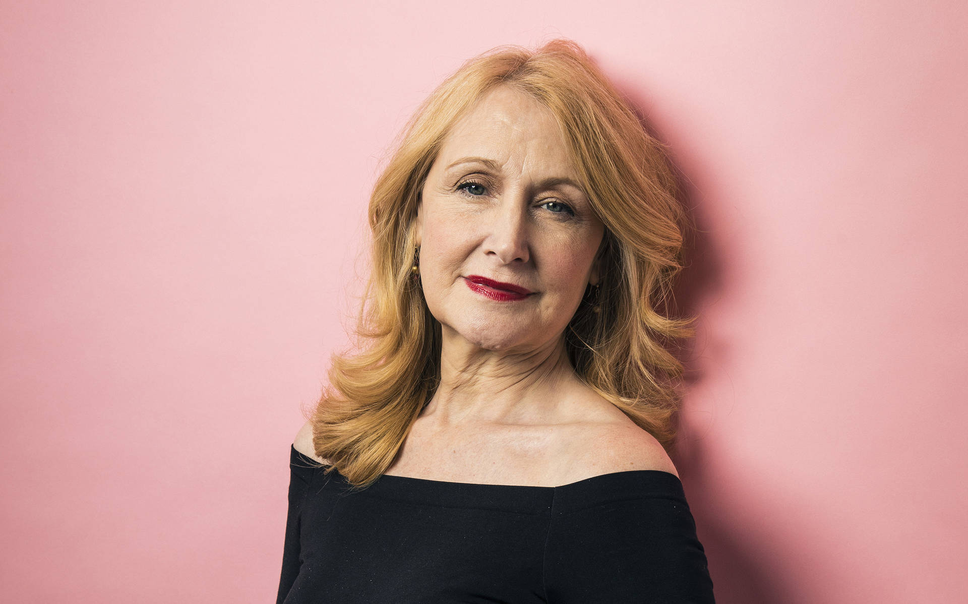 Patricia Clarkson In A Pink Room Background