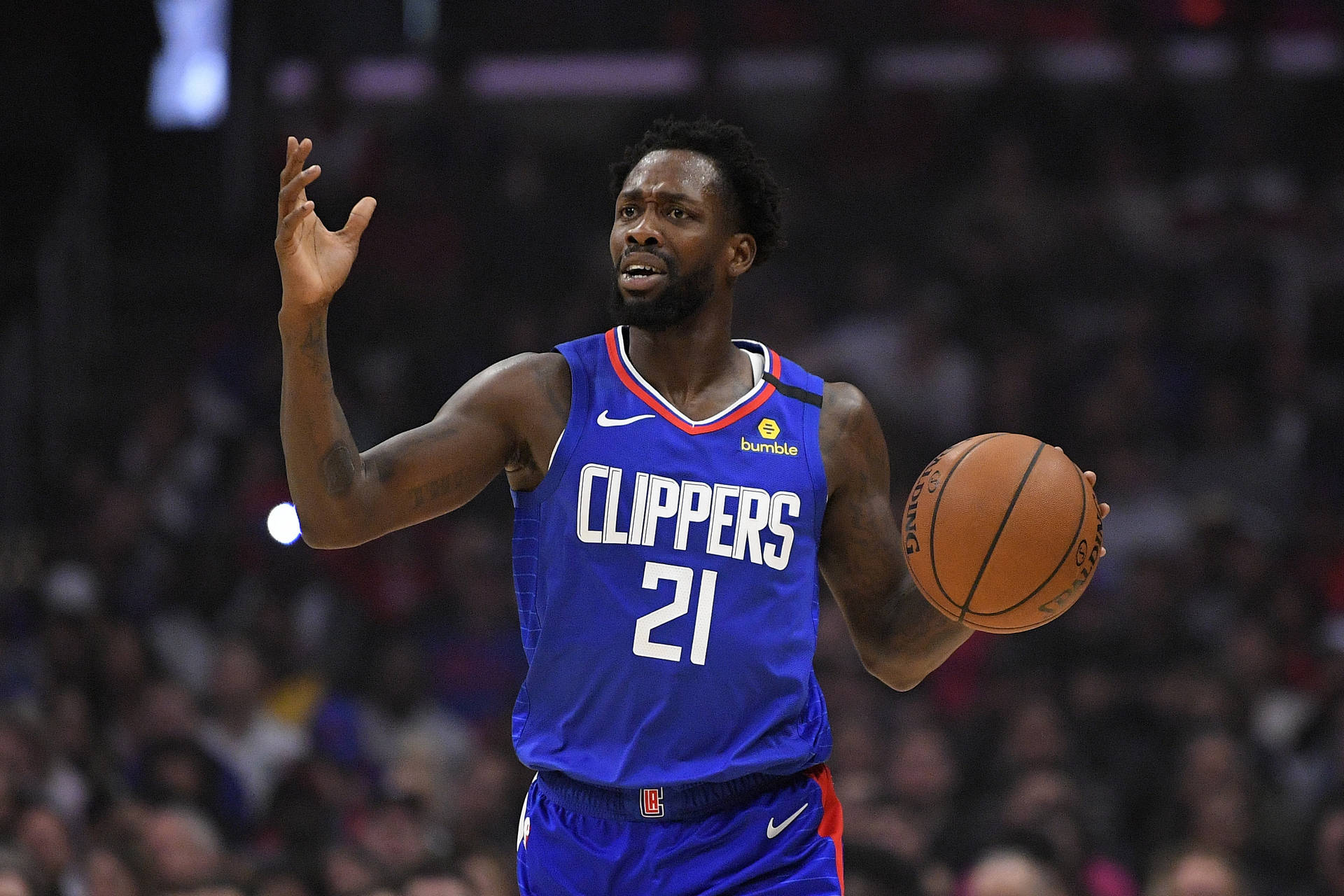 Patrick Beverly In Blue Clippers Jersey Background