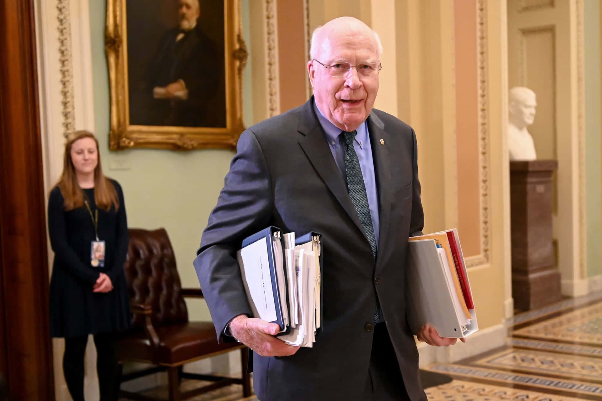 Patrick Leahy Carrying Documents Background