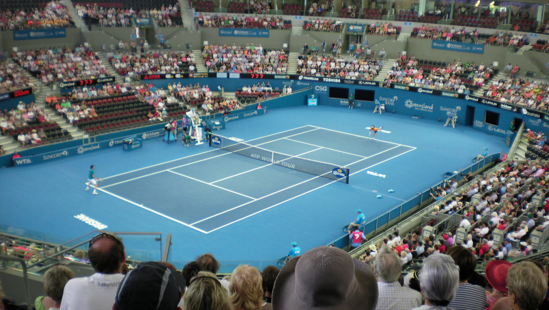 Patrick Rafter Exhibiting Skill And Precision In An Arena Tennis Match Background