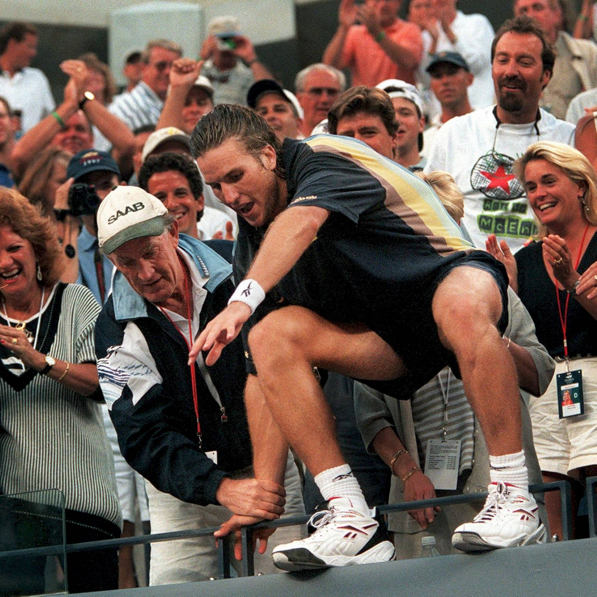 Patrick Rafter Relaxing On A Ledge Background