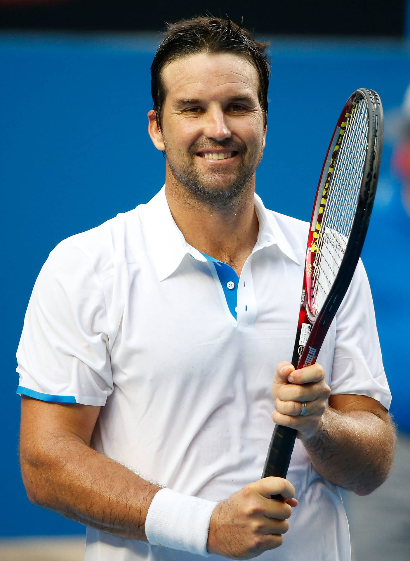 Patrick Rafter Smiling Holding Racket Background