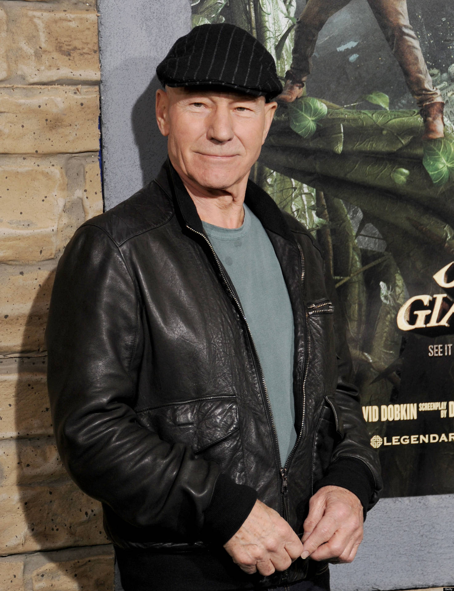 Patrick Stewart Flat Cap And Black Leather Jacket Background