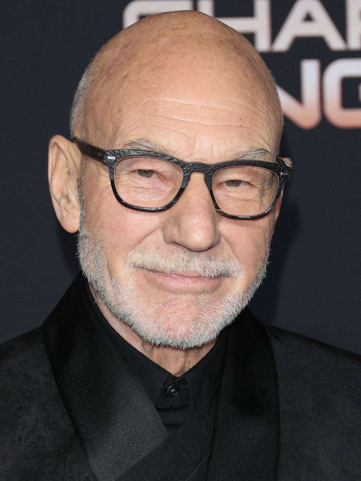 Patrick Stewart In Transparent Black Eyeglasses Background