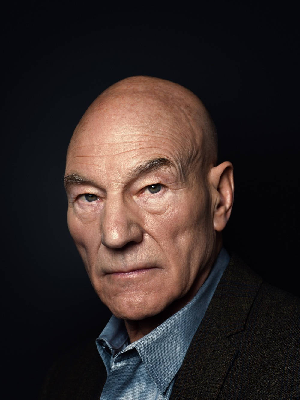 Patrick Stewart On A Dark Background Background