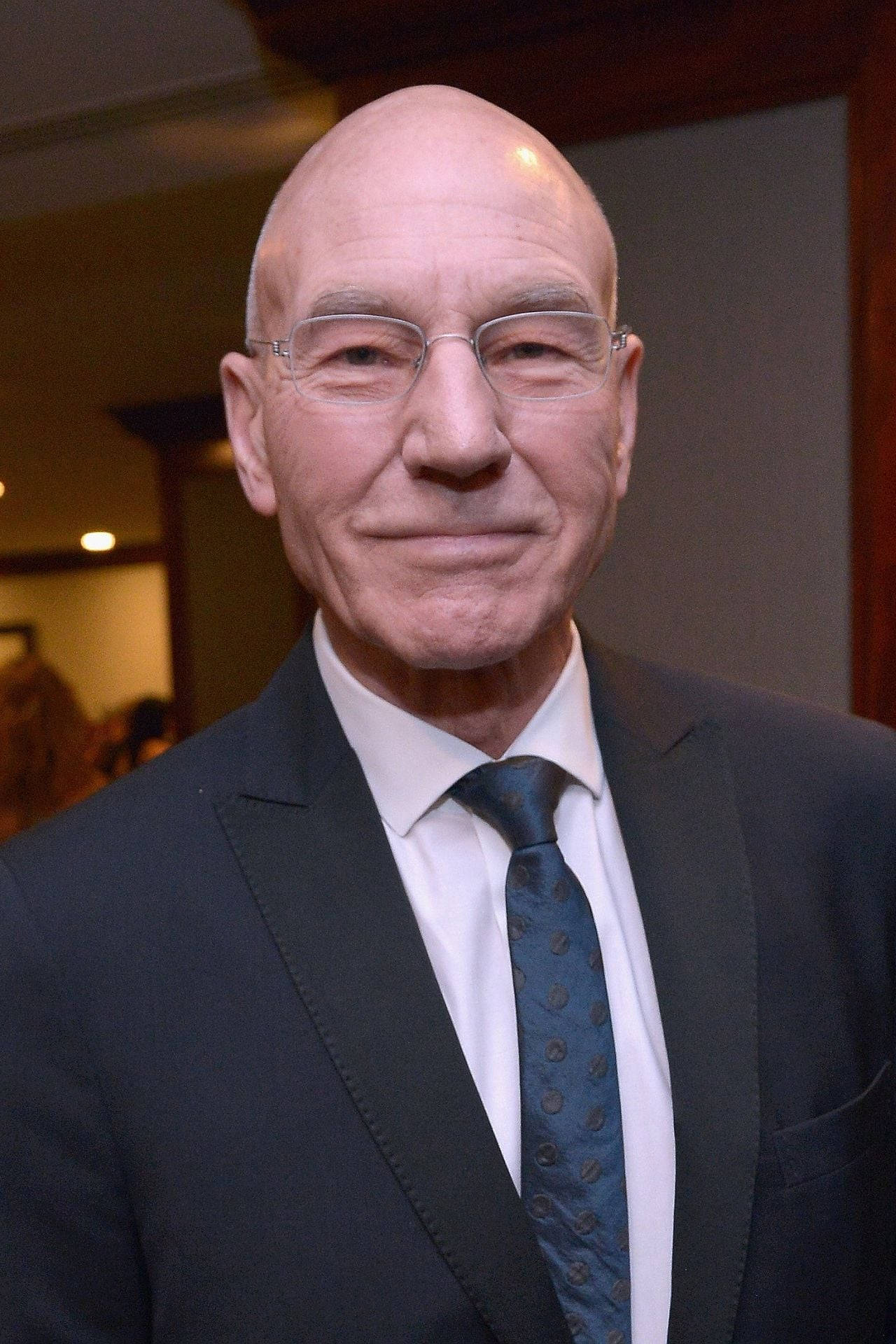 Patrick Stewart With A Beaming Smile Background