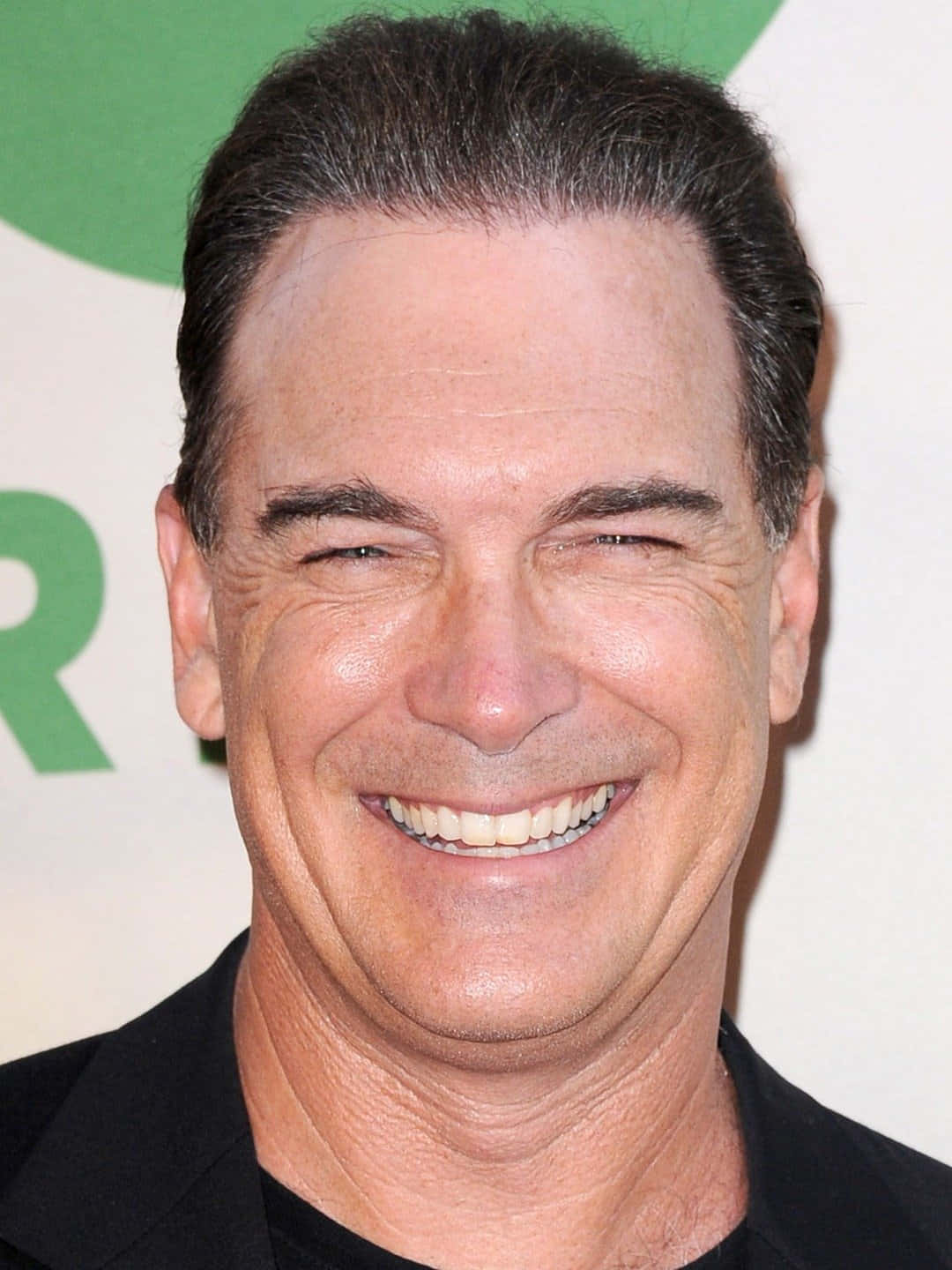 Patrick Warburton In Posed Stance Background
