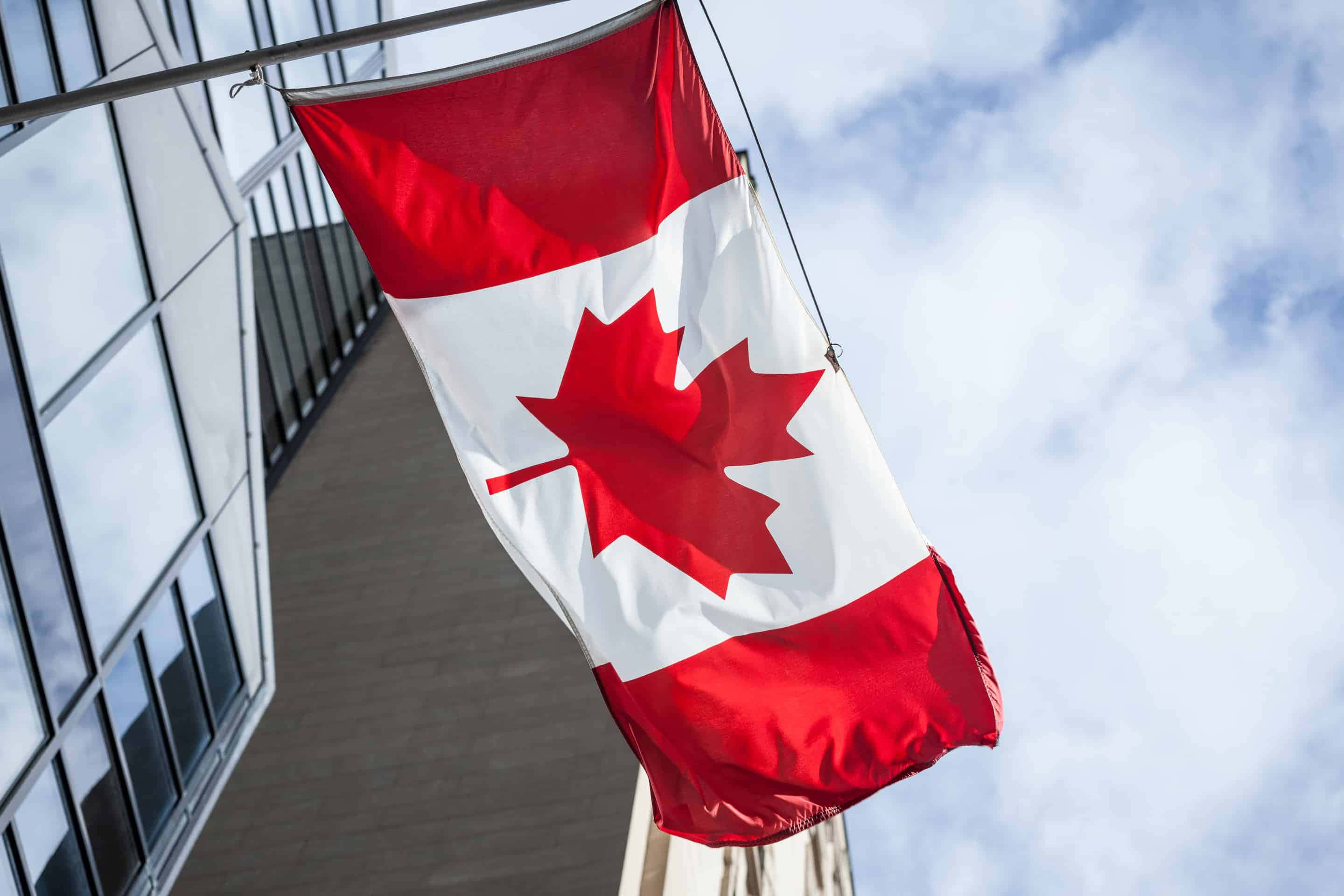 Patriotic Display Of Flag On Elegant Building Background