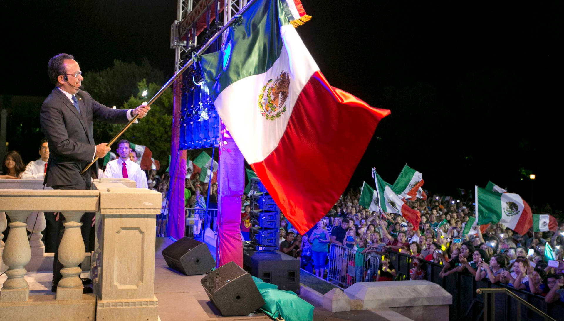 Patriotic Man Holding The Mexico Flag Background
