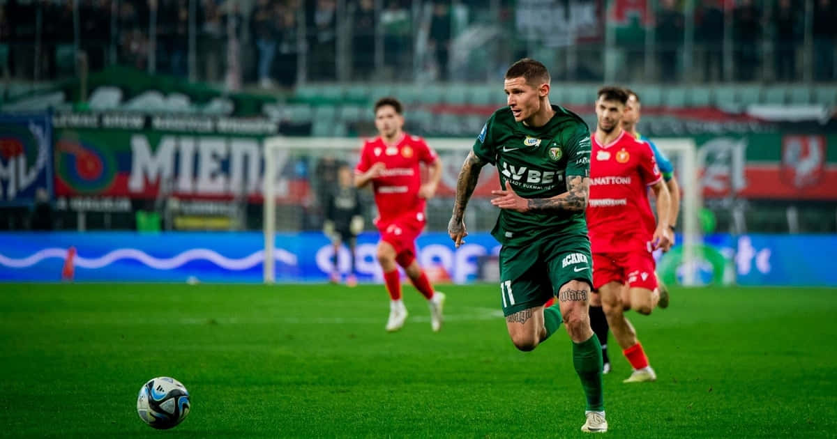 Patryk Klimalain Action During Match Background