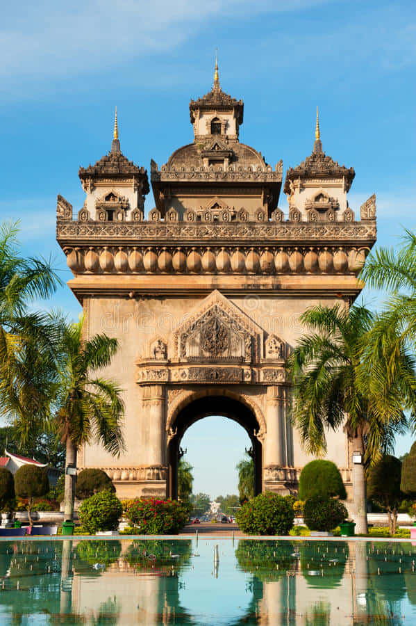 Patuxai Monument Reflecting On Water Background