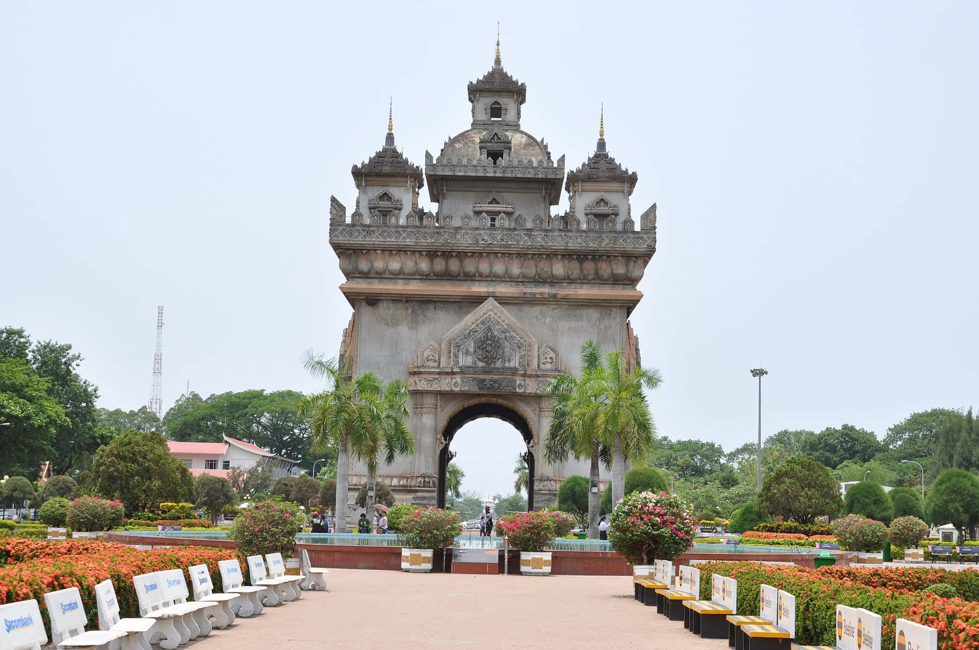 Patuxai Monument With Chairs In Front Background