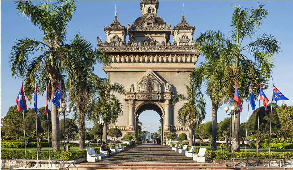 Patuxai War Monument With Flags Background