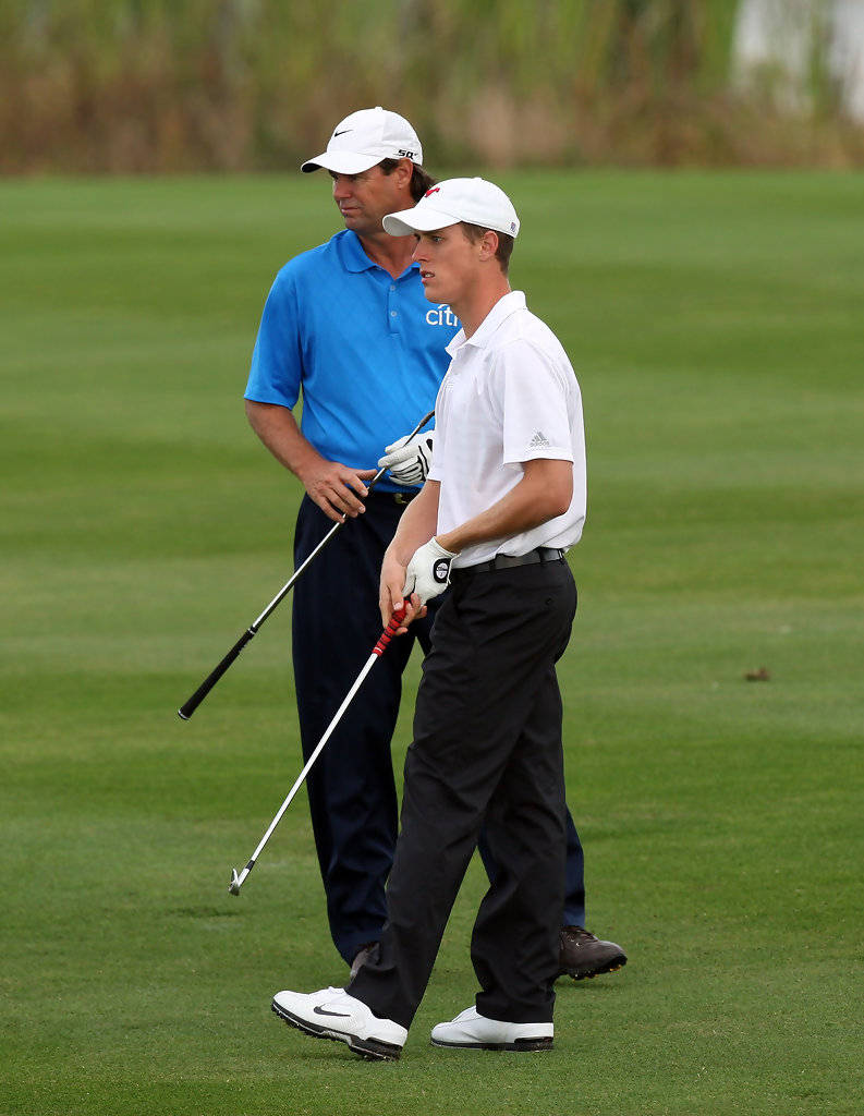 Paul Azinger And Aaron Stewart On Golf Course Background