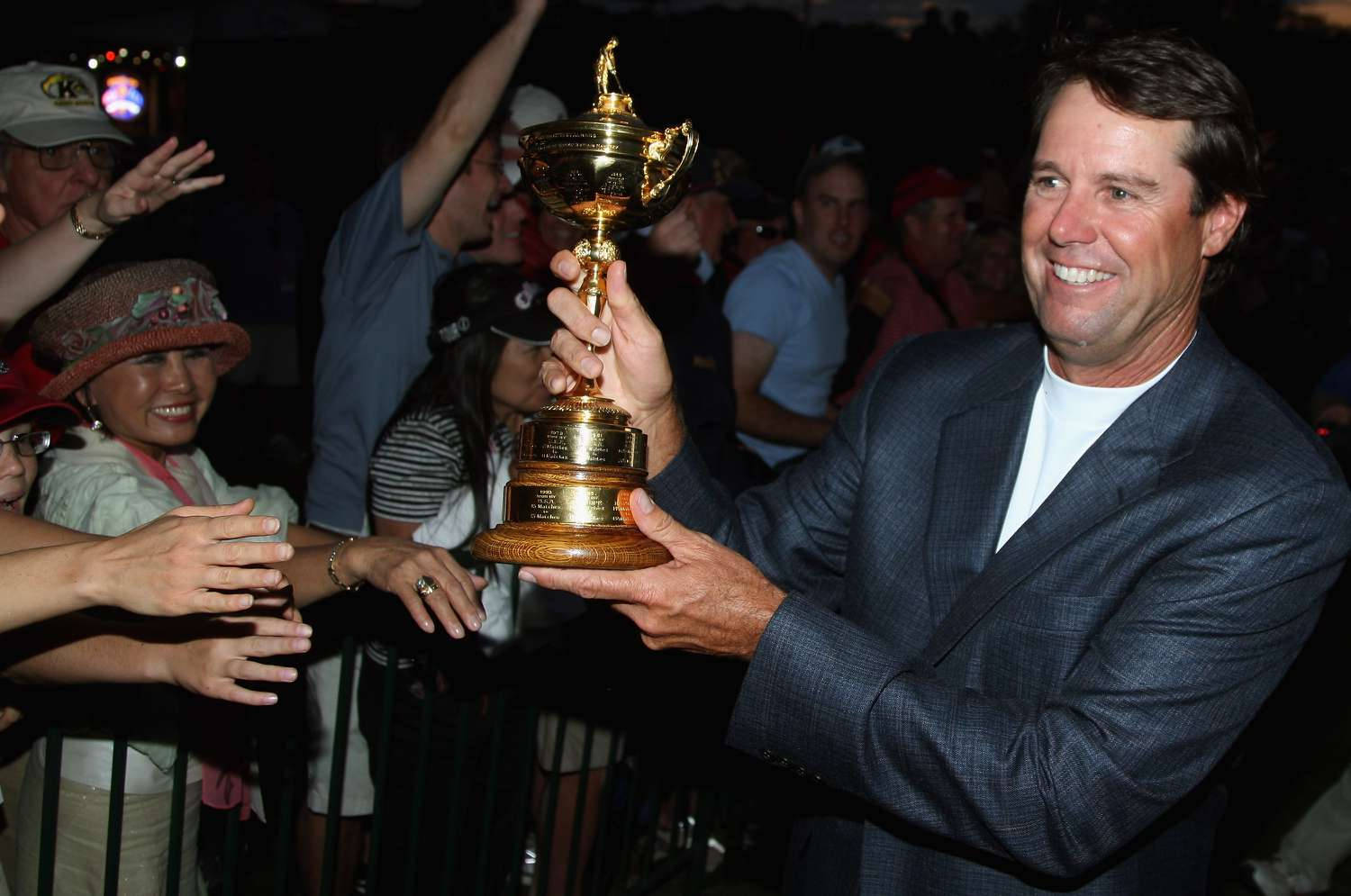 Paul Azinger Showing Trophy To Fans Background