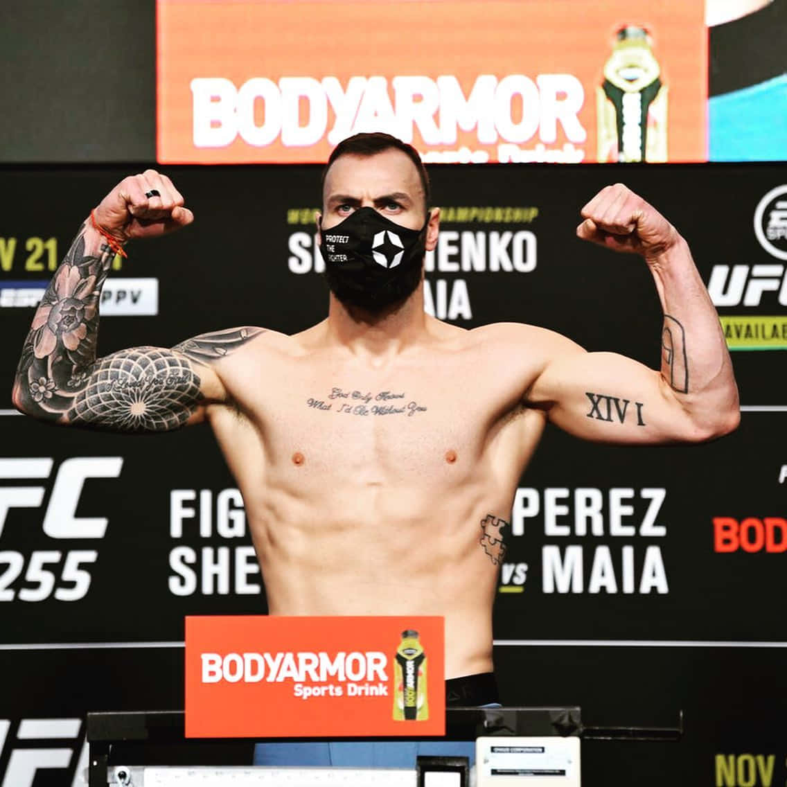 Paul Craig Flexing During Weigh-in Background