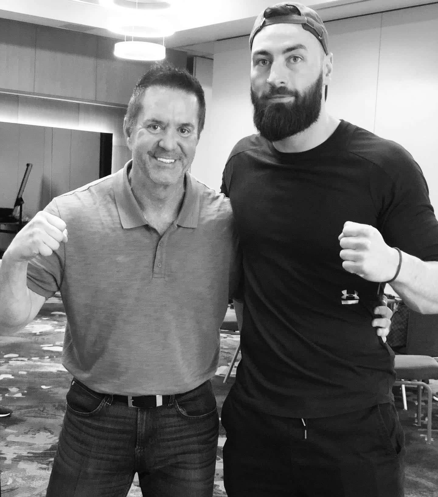 Paul Craig Posing With Fan Background