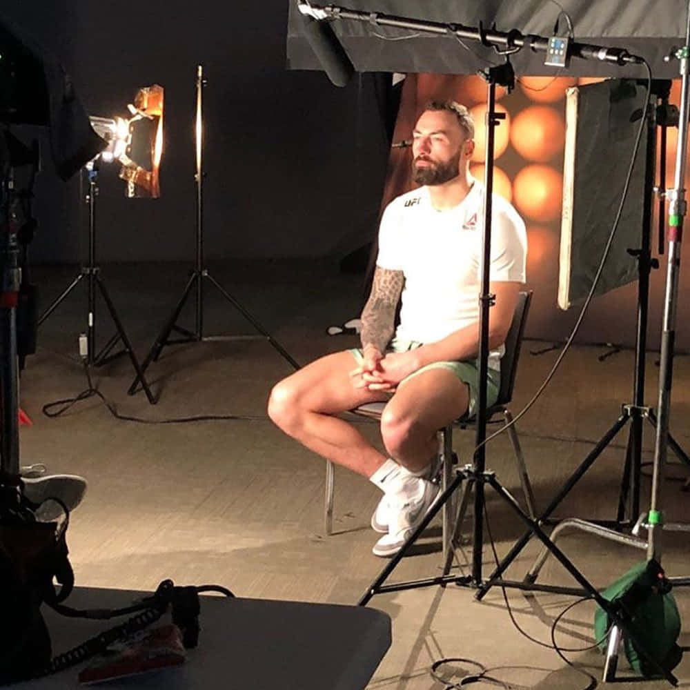 Paul Craig Sitting For Photoshoot Background