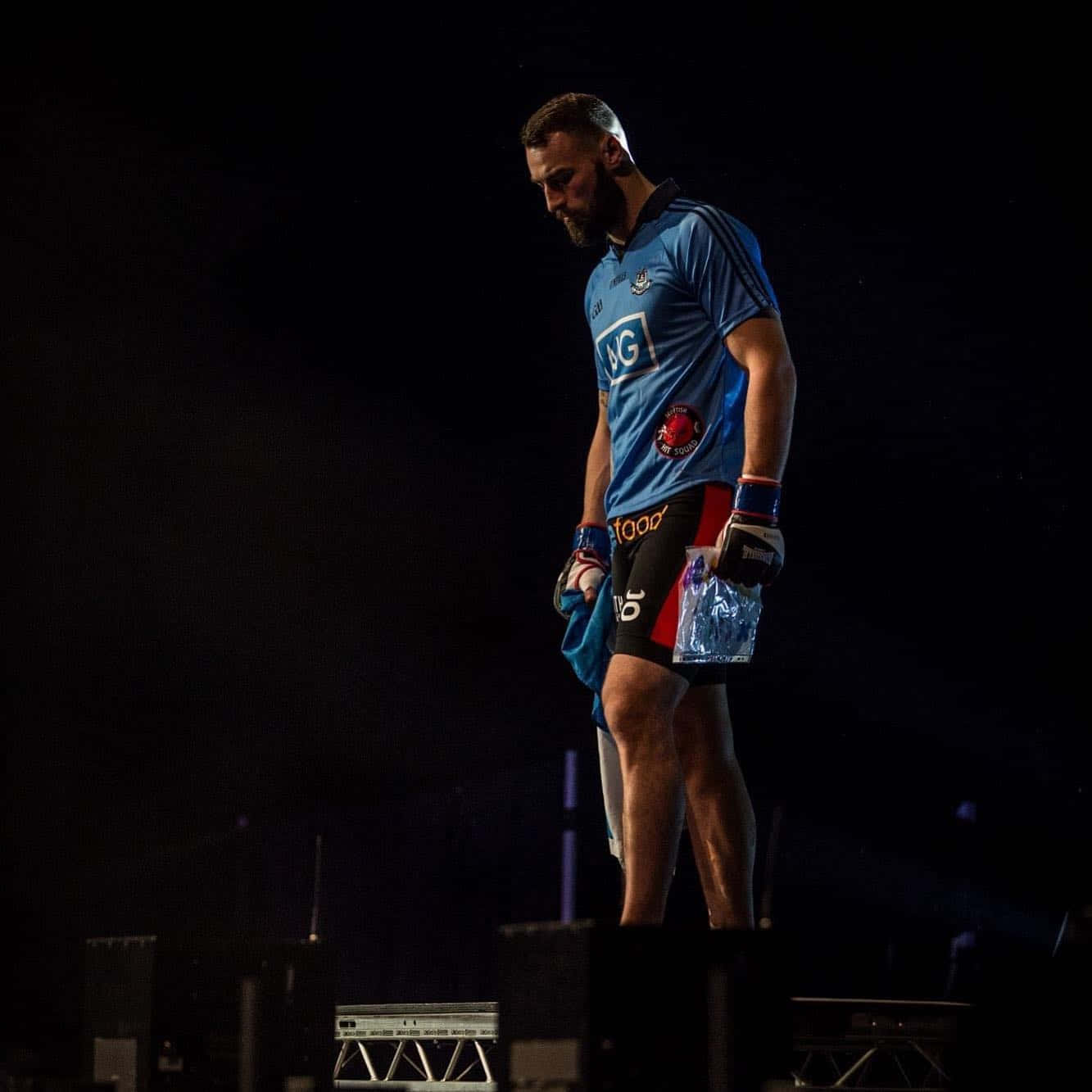 Paul Craig Standing On Stage Background