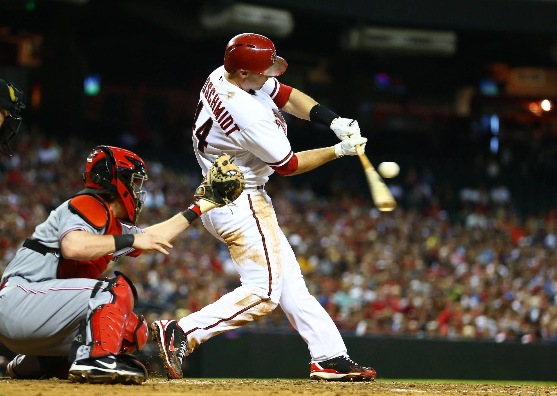 Paul Goldschmidt Hitting Baseball With Bat Background