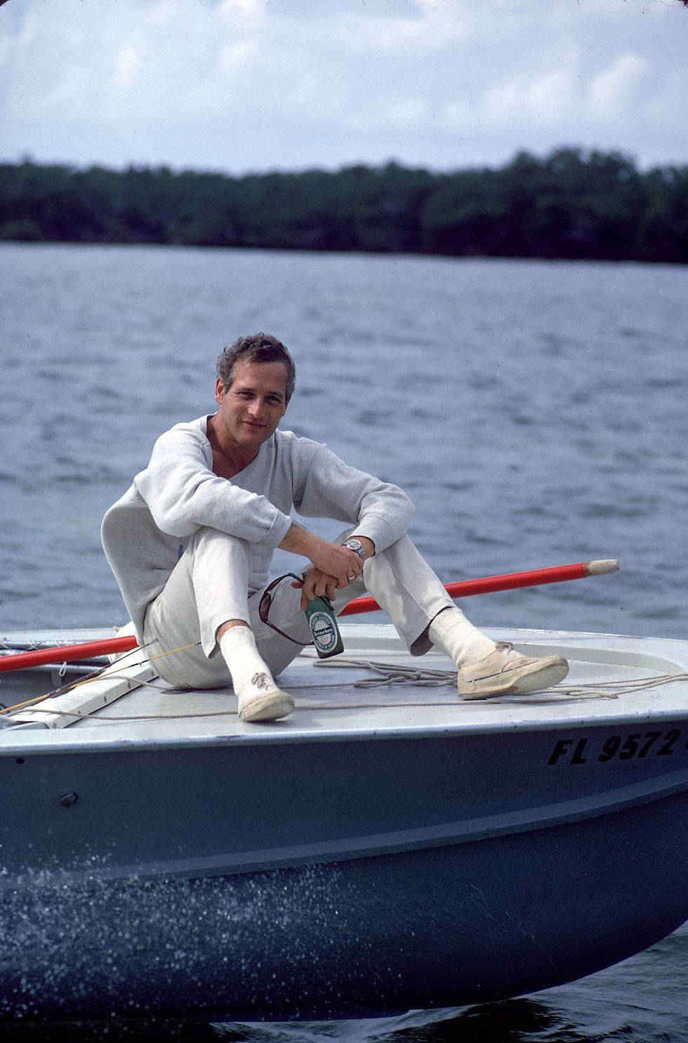 Paul Newman On A Boat Background