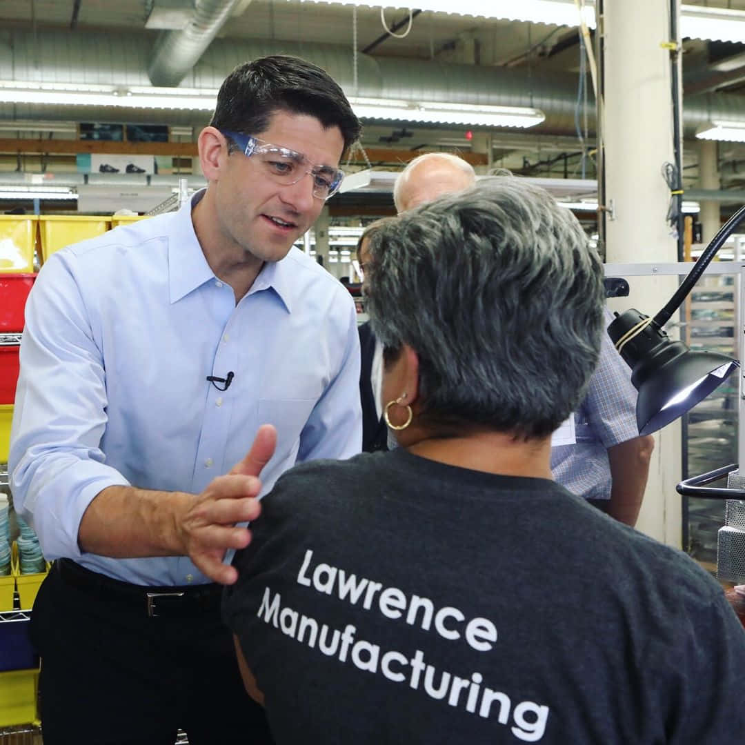 Paul Ryan In Lawrence Manufacturing Warehouse Background
