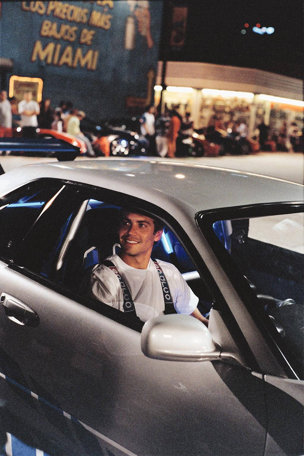 Paul Walker Cruising In A Fast And Furious Car Background