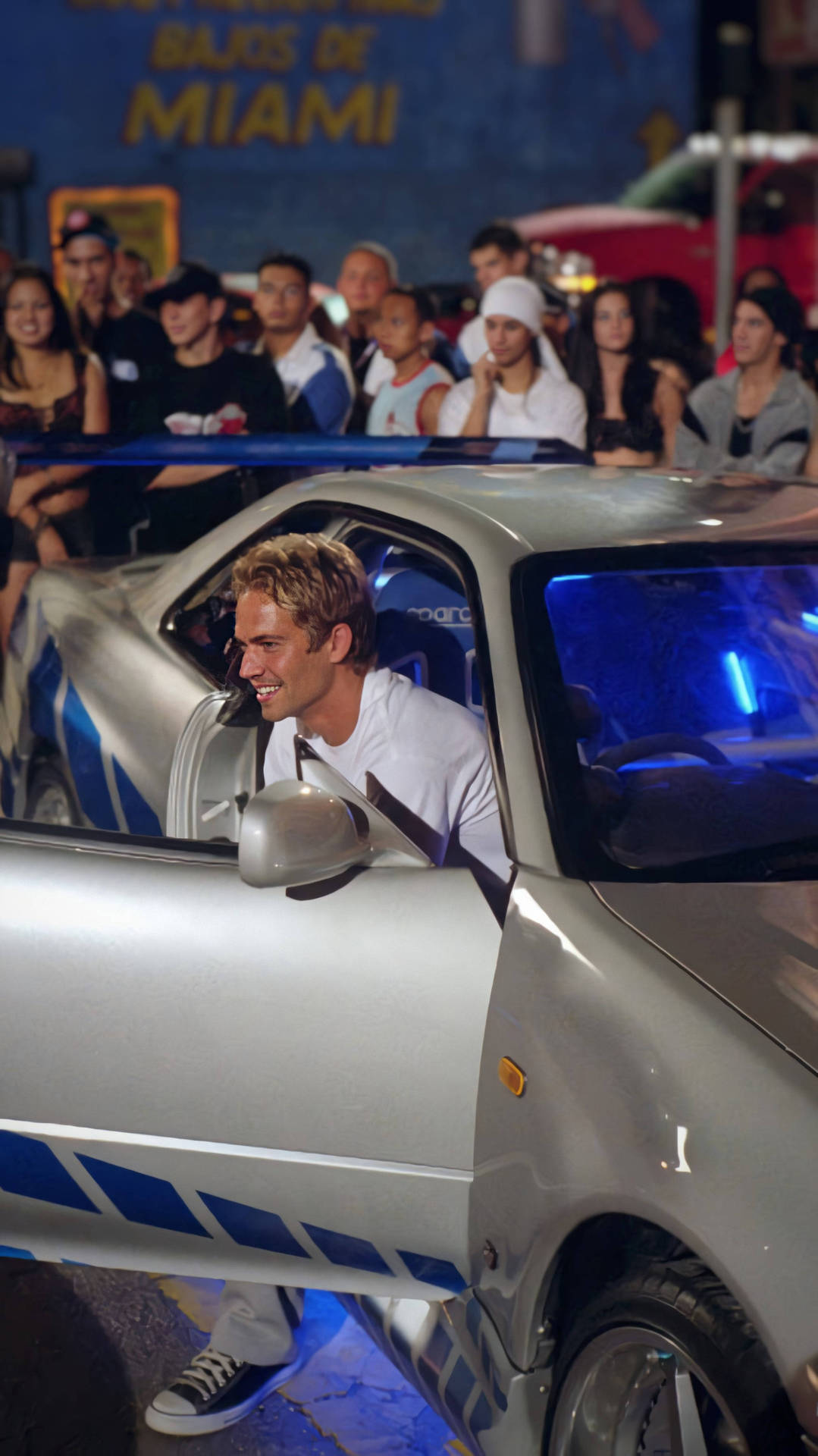 Paul Walker Driving His Car In An Iconic Scene From The Fast And Furious Franchise Background