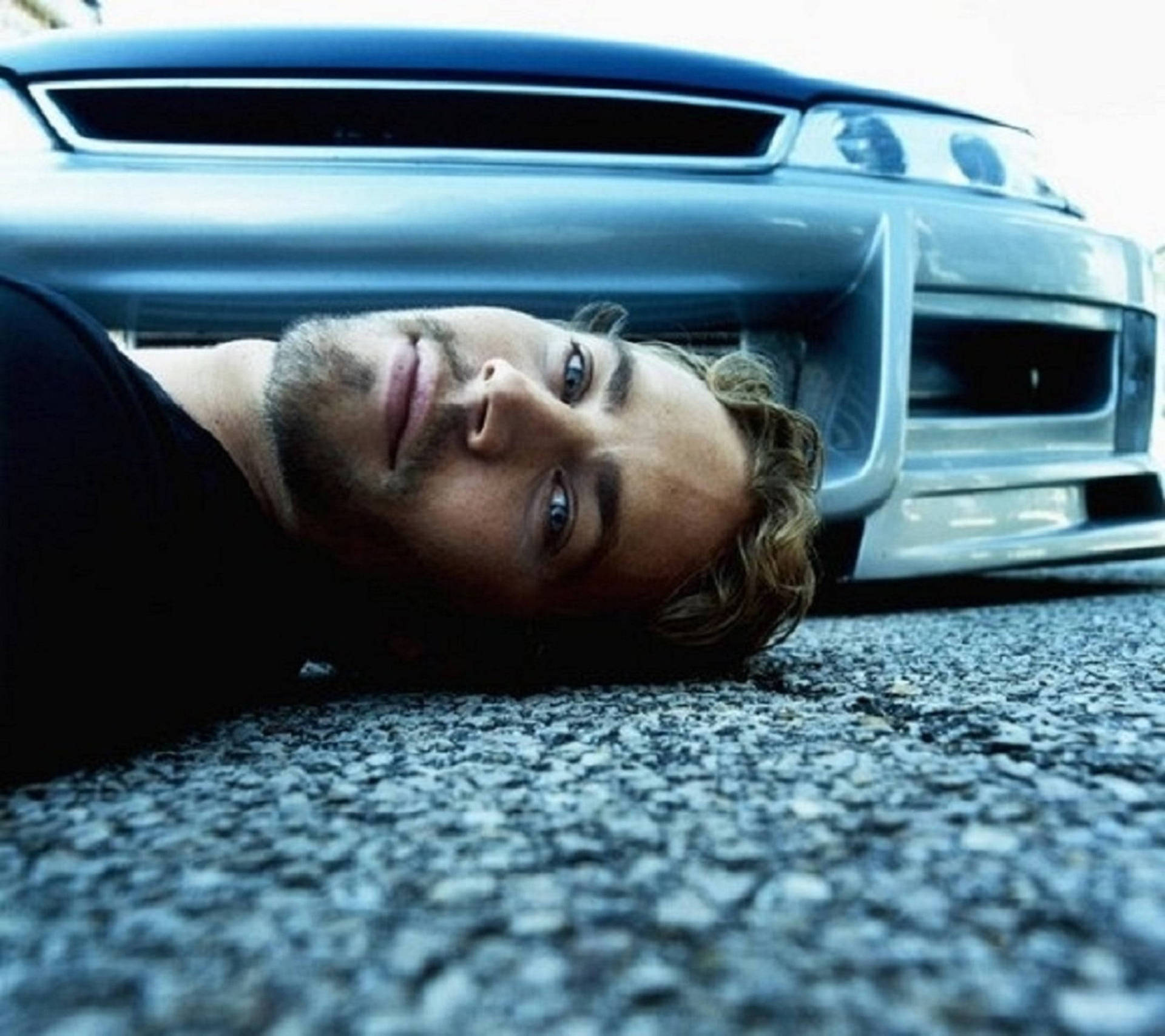 Paul Walker Showing Off His High-performance Car Background