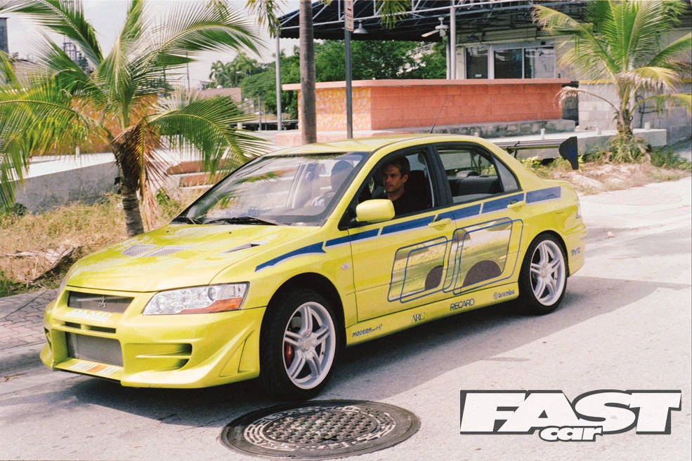 Paul Walker Smiling Next To His Car Background